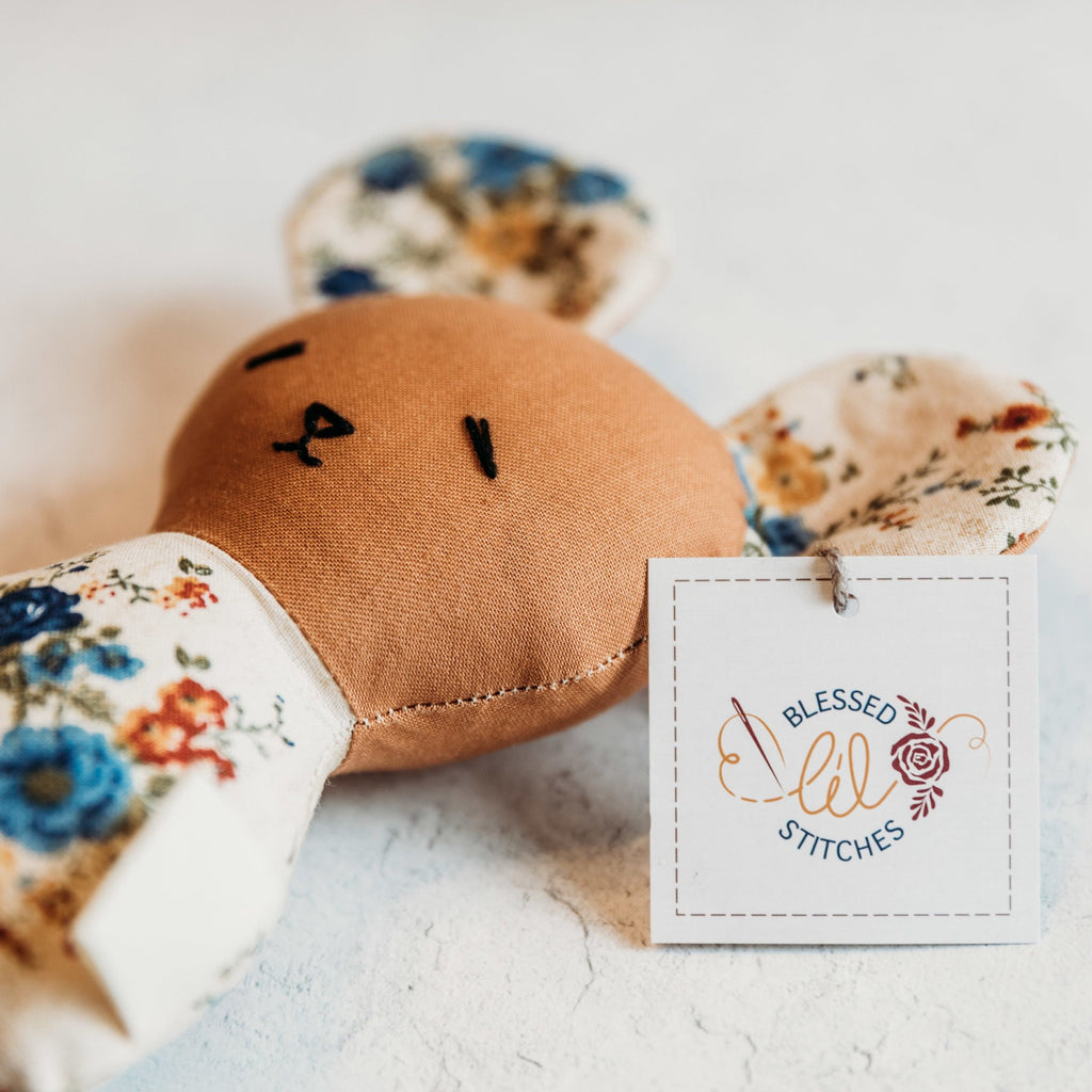 This rattle, handmade by Blessed Lil Stitches, measures about 5-6 inches from top to the bottom. Perfect for a newborn baby. 100% cotton Hand embroidered